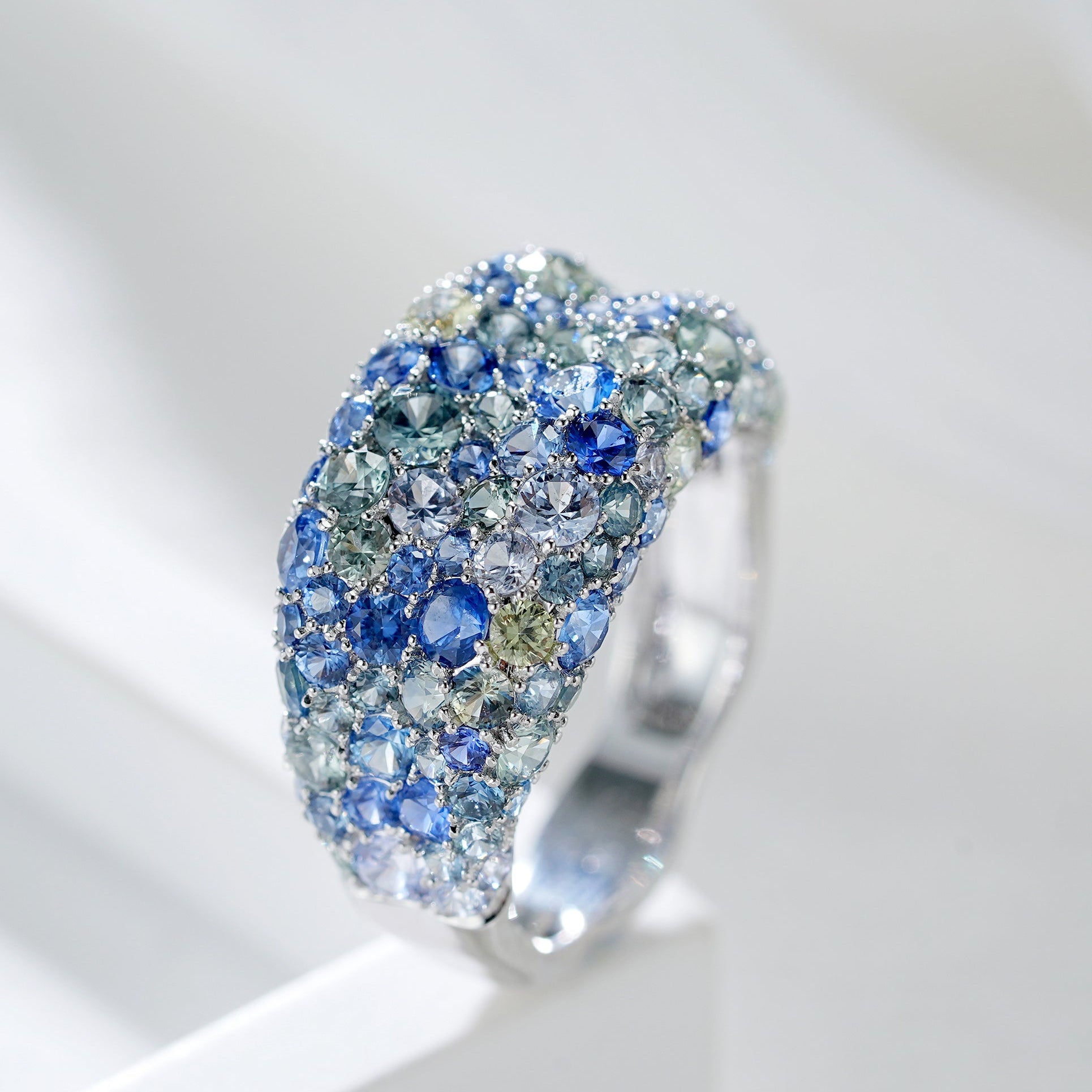 Ring with blue gemstones on a white background